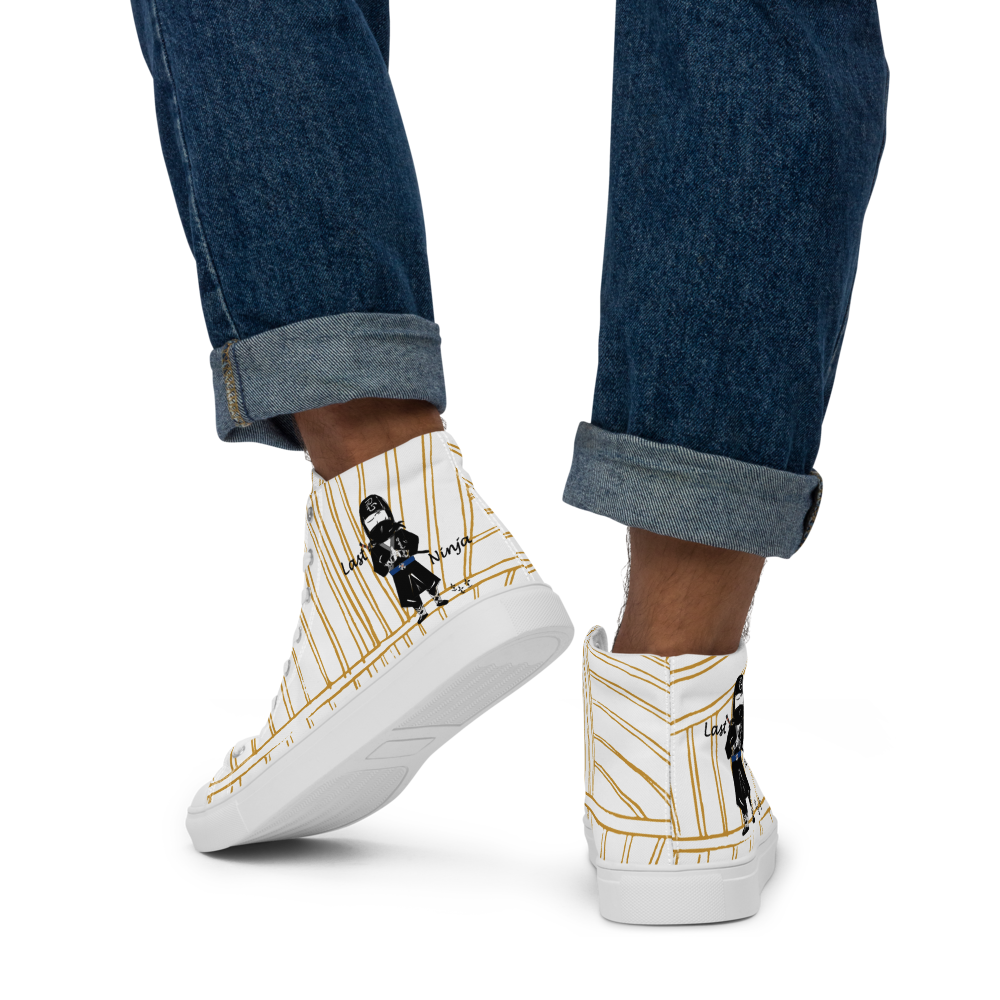 White yellow stripe high-top sneakers with a playful ninja graphic design and white laces, featuring a text 'Last ninja' worn with rolled-up jeans on a white background