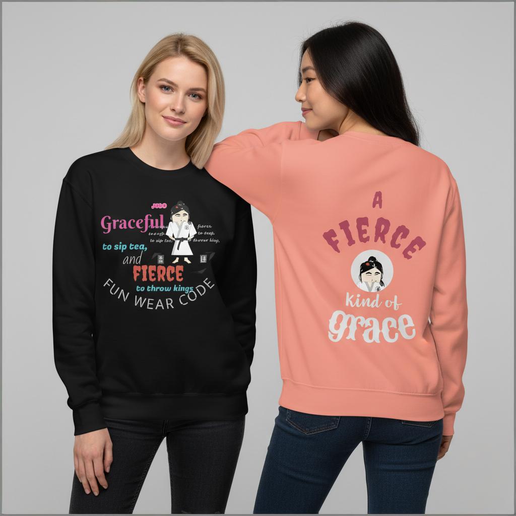 Two women wearing black and pink sweatshirts with text and judo lady graphics on a gray background