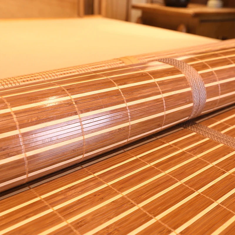 Roll of bamboo blind on a wooden floor