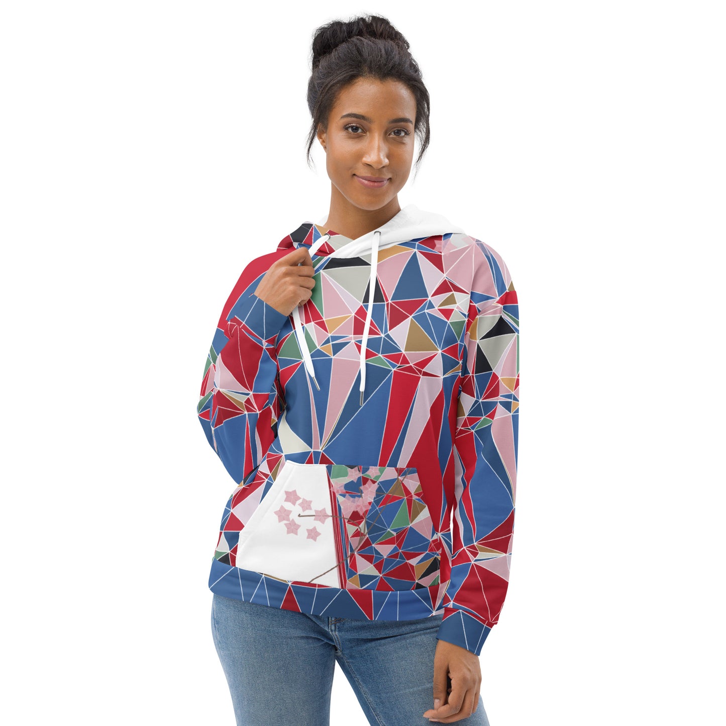 Woman wearing a colorful geometric-patterned hoodie with cherry blossoms graphic on a white background