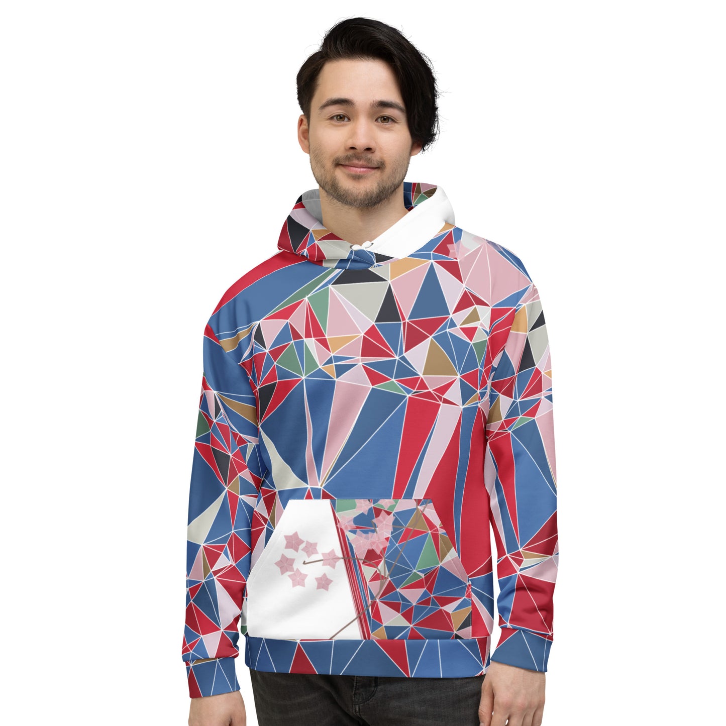 Person wearing a colorful geometric patterned hoodie with cherry blossoms graphic on a white background