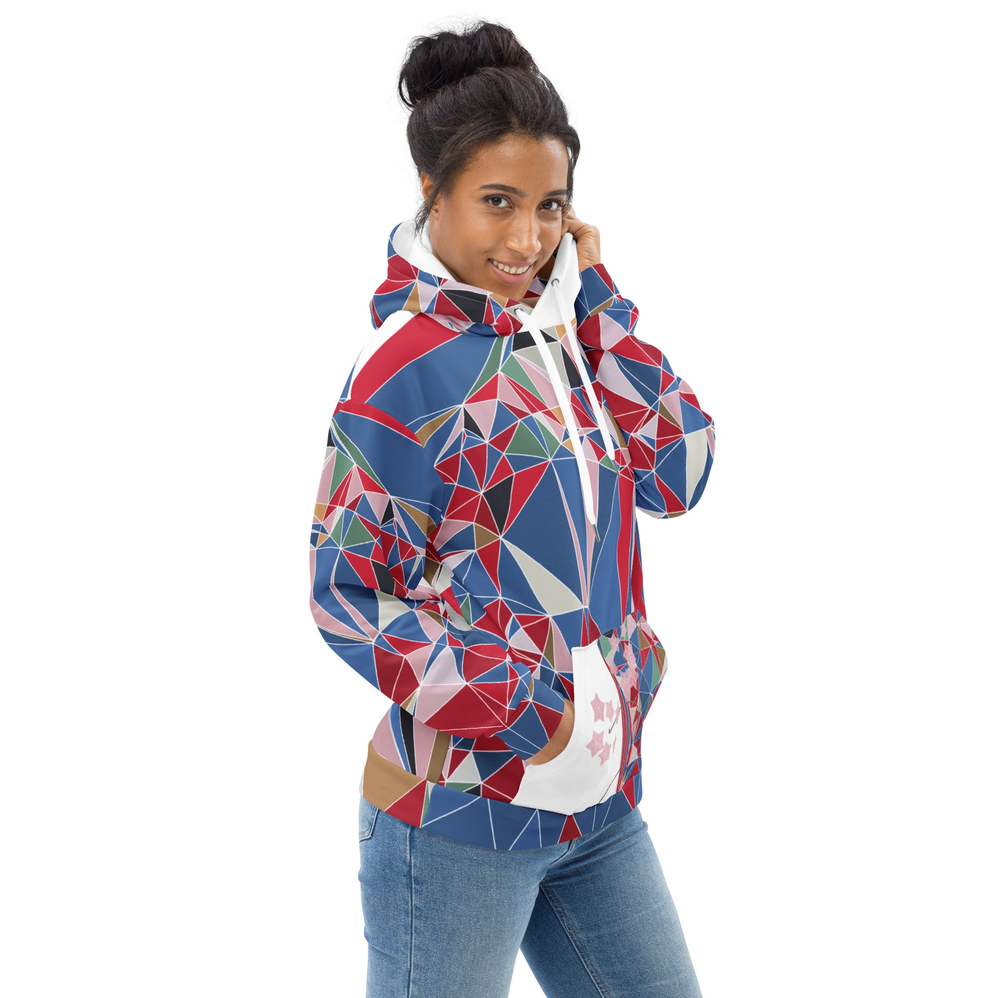 Woman wearing a colorful geometric-patterned hoodie with cherry blossoms graphic on a white background