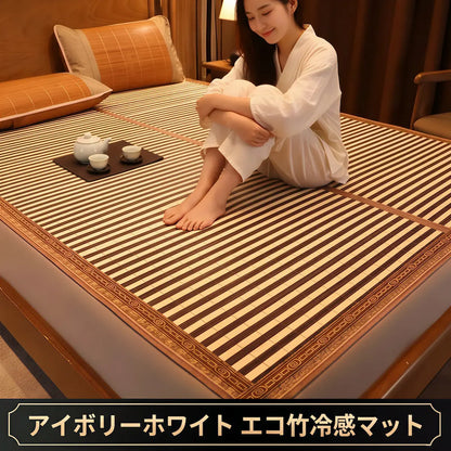 Woman sitting on a striped mattress in a room with a lamp and pillows.