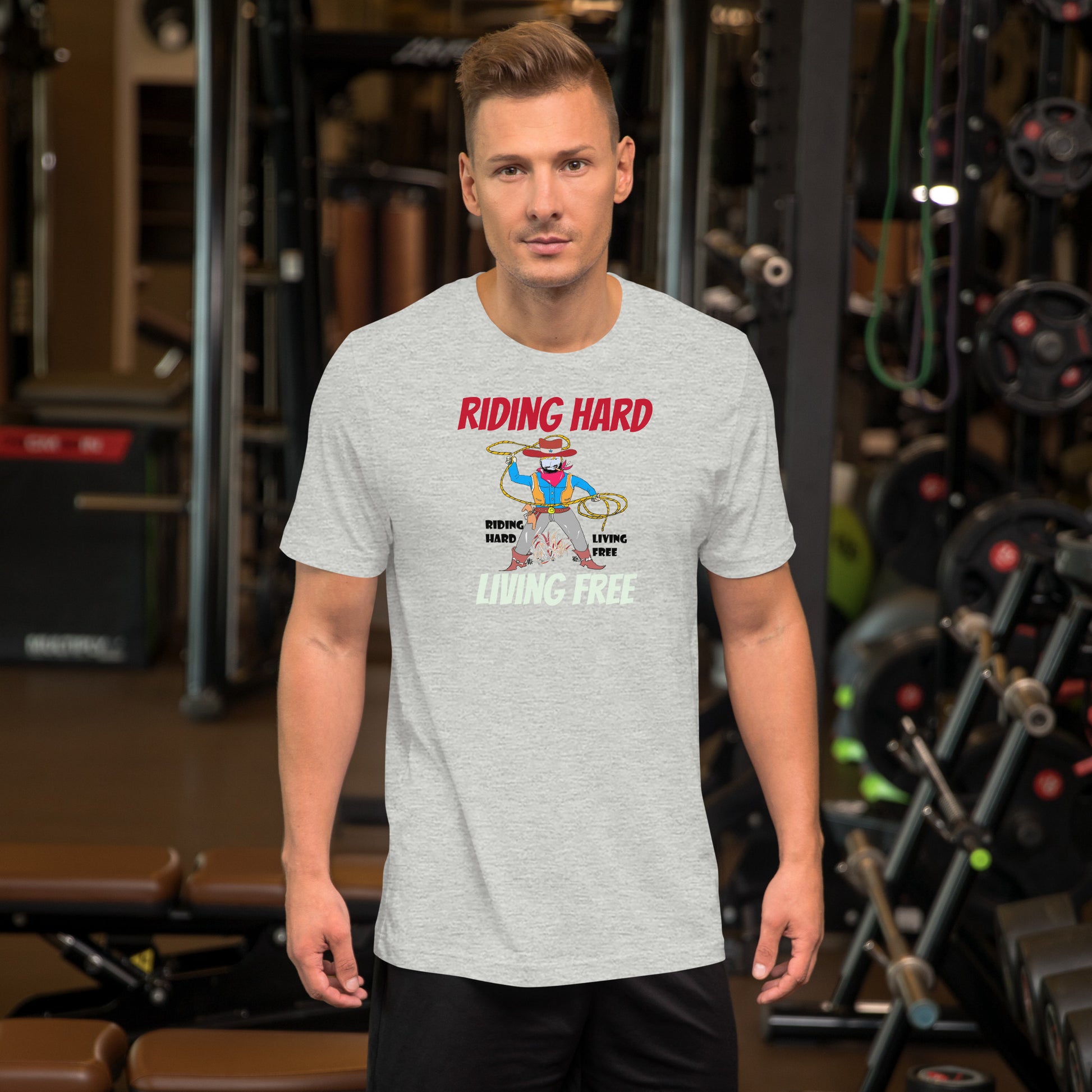 Man wearing a t-shirt with a cowboy graphic design in a gym setting
