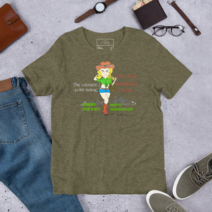 Green t-shirt with a cowgirl graphic design and fun quote on a concrete surface with jeans, shoes, and accessories.